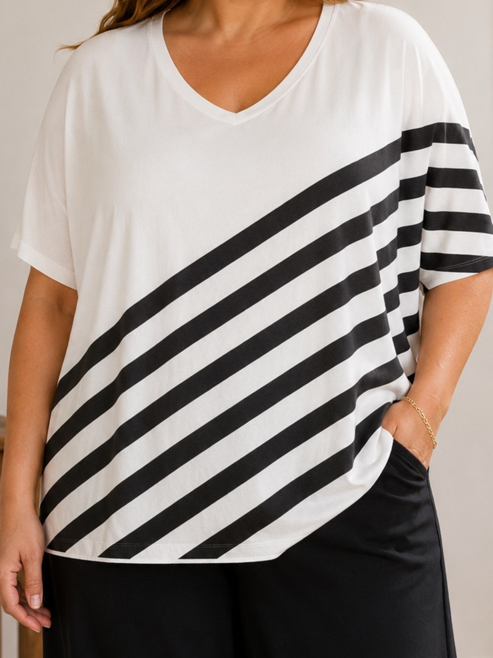 an Elizabeth & Clarke StainTech striped tunic with an asymmetric hem 1x